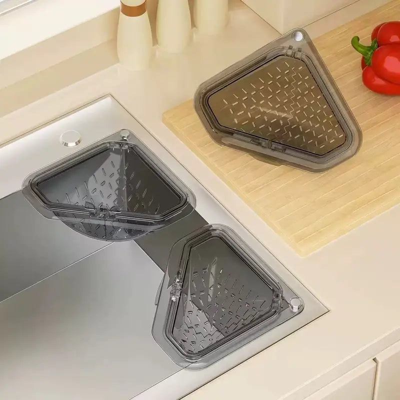 `MCOIKY® Magnetic draining triangular kitchen sink filter for storing food scraps, leftovers, and kitchen waste.