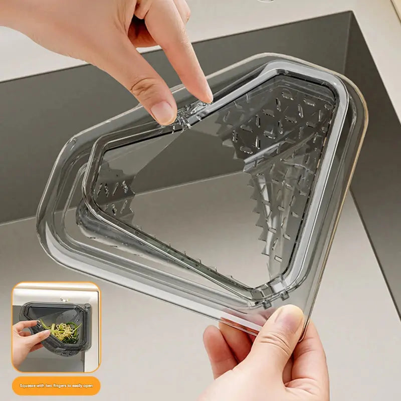 `MCOIKY® Magnetic draining triangular kitchen sink filter for storing food scraps, leftovers, and kitchen waste.
